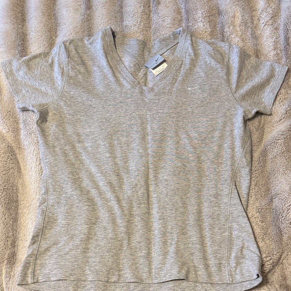Nike shirt size XL tight fitting 
I think it fits like a medium/large